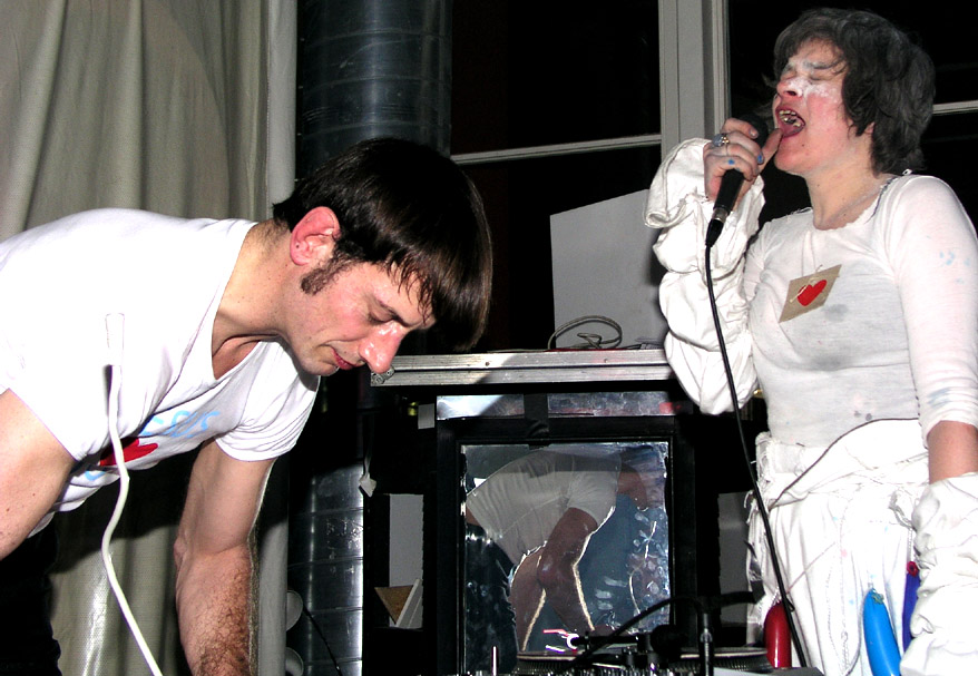 a DJ and a girl, who is screaming